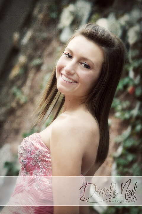 Senior photos in pink prom dress standing in the alley in Westerville
